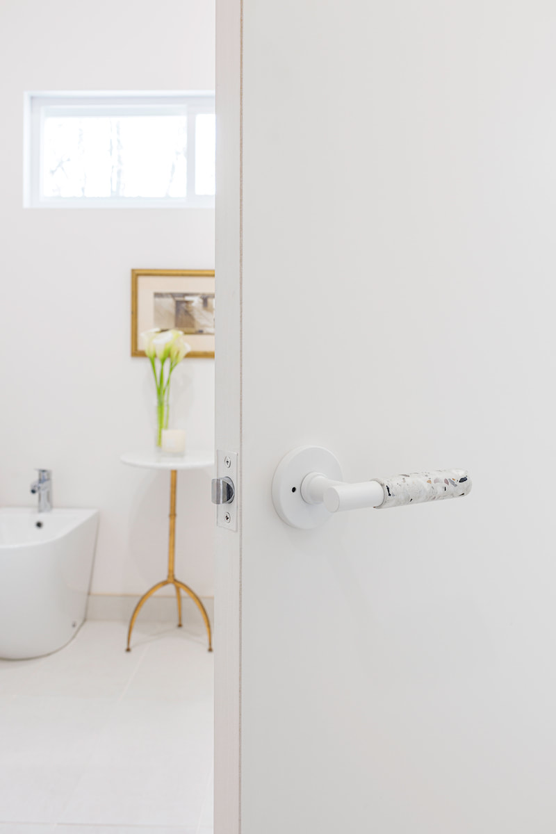 Modern white bathroom and white door handle