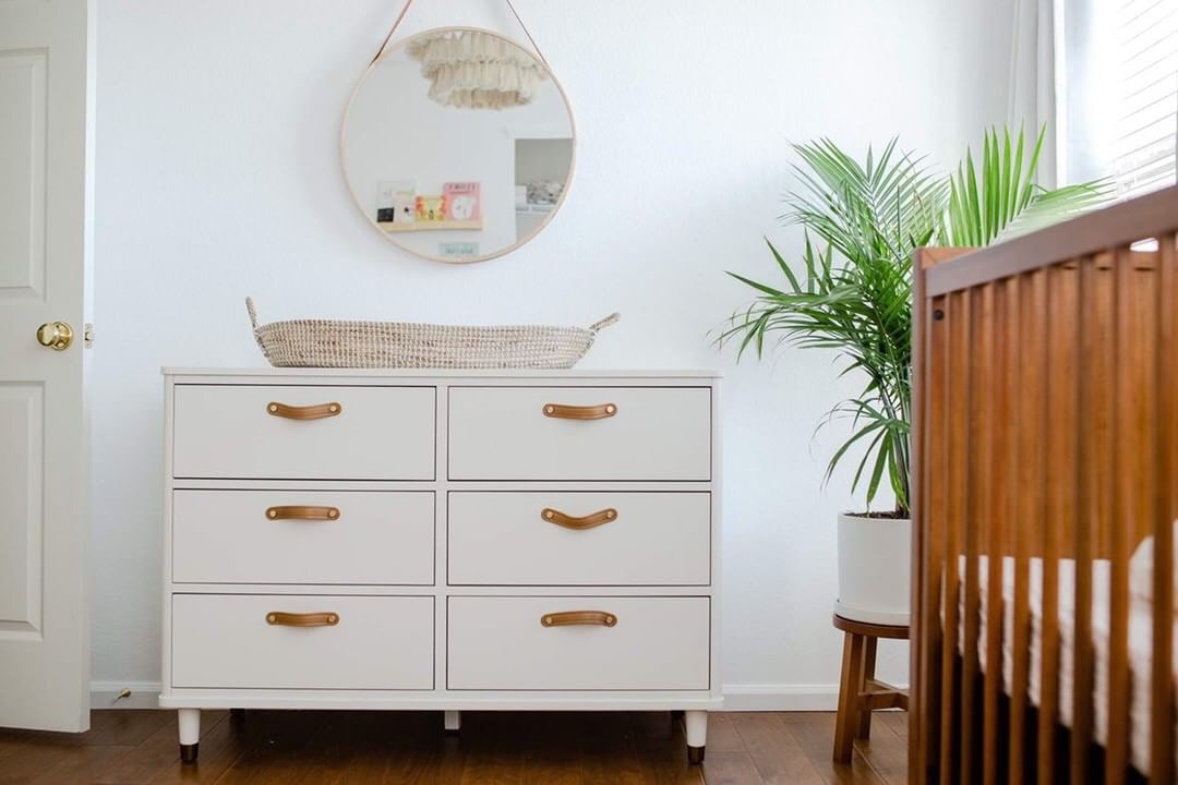 White dresser for changing area with round mirror, YouthfulNest Nursery Design