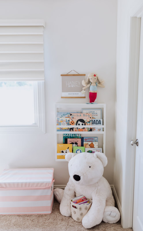 Book storage pretty pink and white baby girl nursery