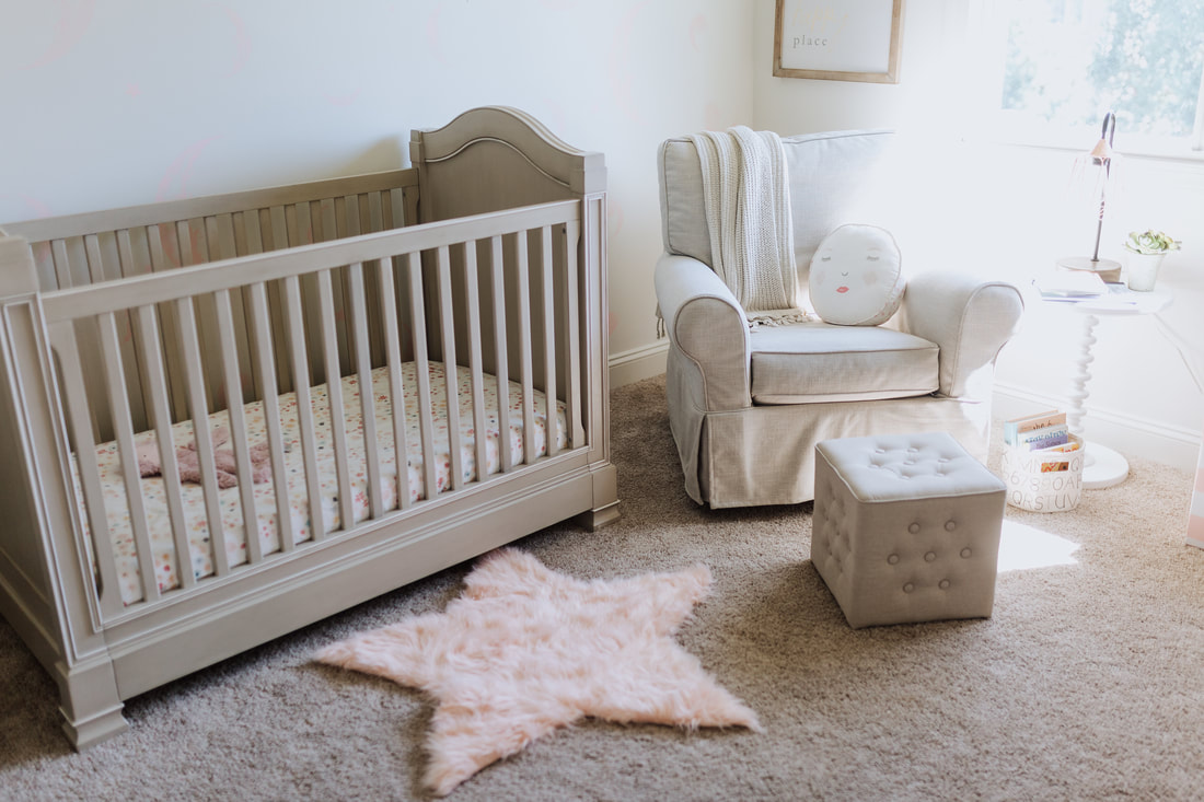 Pretty pink and white baby girl nursery