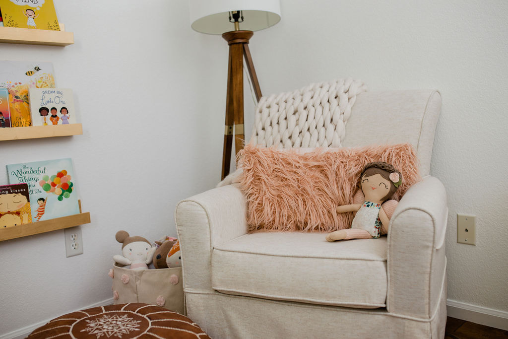 Cream glider with faux fur pink pillow, YouthfulNest Nursery Design