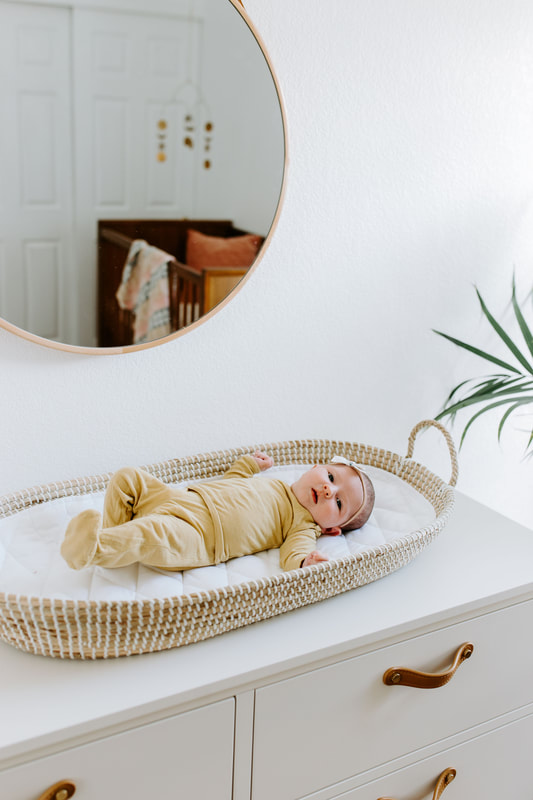 baby in moses basket, YouthfulNest Nursery Design