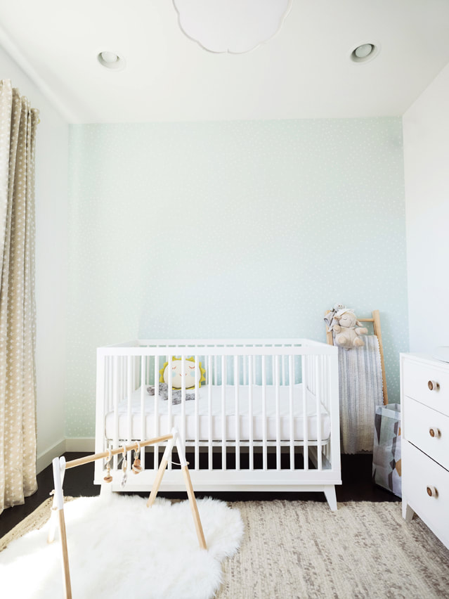 Gender neutral nursery with Anewall cutoms mint wallpaper