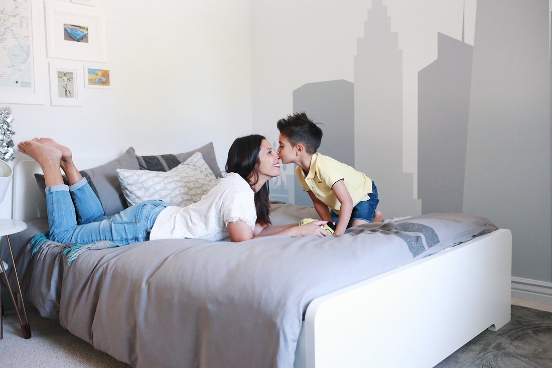 mom and son in big boy bedroom, ideas for nursery transitioned into big kid bedroom 